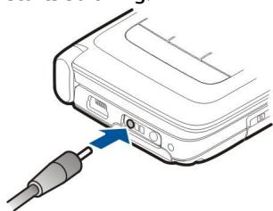 NOKIA E90 - Charge the battery - 1