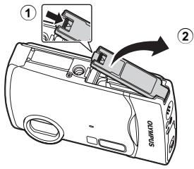 OLYMPUS Μ 850SW - b. Insert the battery and an xD-Picture Card (optional) in the camera. - 1