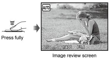 OLYMPUS FE-360 - Press the shutter button halfway down to focus on the subject. - 2