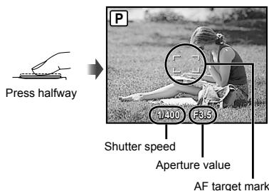 OLYMPUS Μ 1060 - Press the shutter button halfway down to focus on the subject. - 1