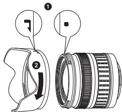 Diagram showing camera lens assembly with labeled parts and directional arrows indicating motion or alignment.