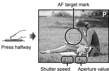 OLYMPUS Μ TOUGH-6020 - Press the shutter button halfway down to focus on the subject. - 1