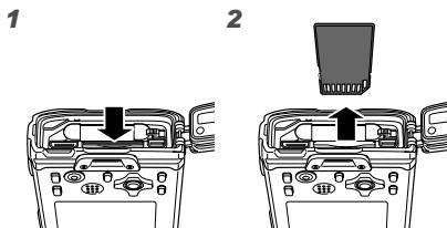 OLYMPUS Μ TOUGH-6020 - To remove the SD/SDHC memory card - 1