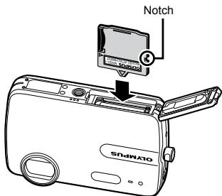 OLYMPUS Μ-550WP - Insert the microSD Attachment into the camera. - 1