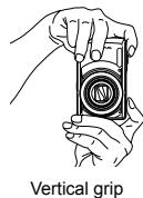 OLYMPUS Μ-7030 - Hold the camera and compose the shot. - 2