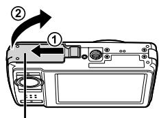 Diagram of a camera module with labeled parts and directional arrow indicating rotation or movement