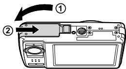 Diagram of a digital camera with labeled parts and directional arrow indicating rotation or change