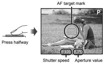 OLYMPUS TG-320 - Press the shutter button halfway down to focus on the subject. - 1