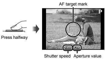 OLYMPUS TG-820 - Press the shutter button halfway down to focus on the subject. - 1