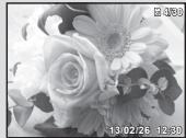 OLYMPUS VG-180 - Press the zoom buttons. - 2