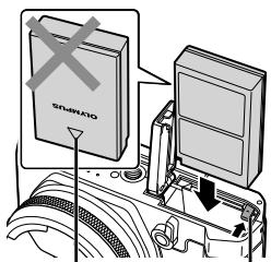 OLYMPUS STYLUS 1S - Insert the battery while sliding the battery lock knob in the direction of the arrow. - 1