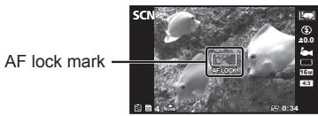 OLYMPUS TG 850 - To lock the focus distance for underwater shoots (AF lock) - 1