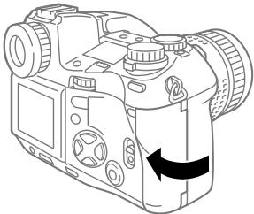OLYMPUS CAMEDIA E-10 - While pressing down the round release on the card cover lock, slide and raise the card cover lock. - 3