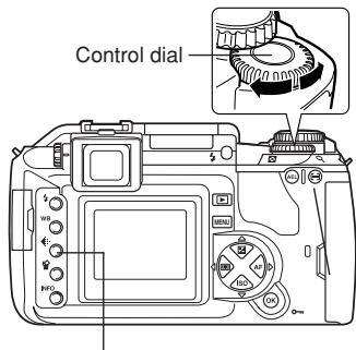 OLYMPUS CAMEDIA E-300 - After pressing the button, rotate the control dial. - 1