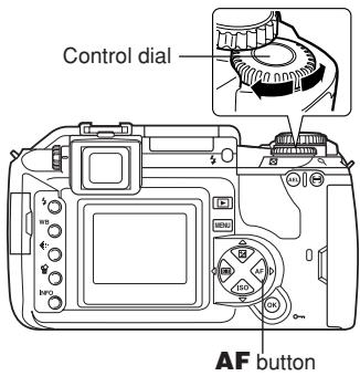 OLYMPUS CAMEDIA E-300 - Rotate the control dial until the desired setting is displayed. - 1