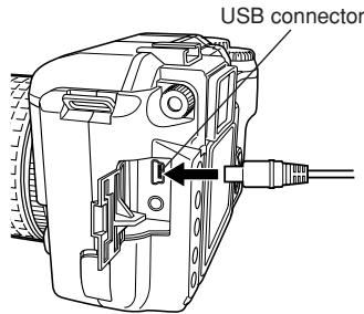 OLYMPUS E-300 - Plug the USB cable into the camera's USB connector and turn the camera on. - 2