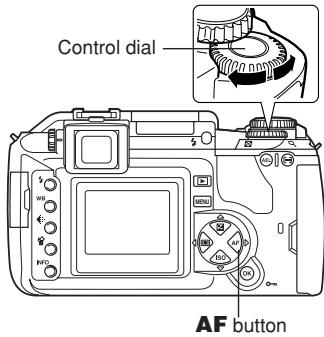 OLYMPUS E-300 - Rotate the control dial until the desired setting is displayed. - 1