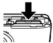 OLYMPUS D-710 - To remove the SD/SDHC memory card - 1