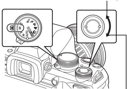 Diagram of a camera mode dial with labeled components and directional arrows indicating rotation or adjustment.