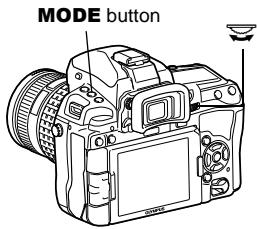 OLYMPUS E-5 - While holding down the MODE button, turn the main dial to set the shooting mode to M. Turn the dials to set the aperture value and the shutter speed. - 1
