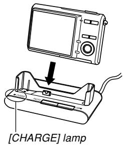 CASIO EXZ6-EX-Z7 - With the camera positioned with the monitor screen facing forward as shown in the illustration, place it onto the USB cradle. - 1