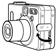 Technical line drawing of a digital camera with Chinese label indicating rotation direction