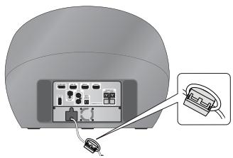 SAMSUNG HT-D7200B - Colocacion del nucleo de ferrita toroidal en el cable de alimentacion del subwoofer - 1