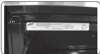 Close-up of a car door panel with visible brand and price tags, including Samsung and BMW branding