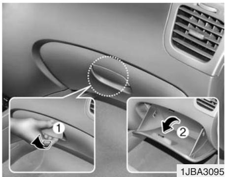 KIA RIO - Compartiments multiples (selon l'équipement) - 1