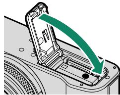 FUJIFILM X100V - Fermez le couvercle du compartment de la batterie. - 2