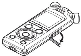 OM SYSTEM LSP5 - Retrait d'une carte microsd - 1