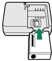 FUJIFILM X-E3 - Place the battery in the charger. - 1