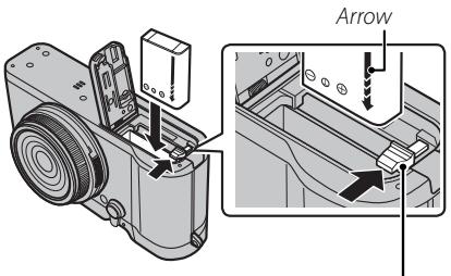 FUJIFILM X-T100 - Insert the battery. - 1