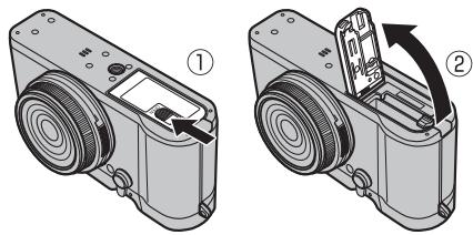 FUJIFILM X-T100 - Open the battery-chamber cover. - 1