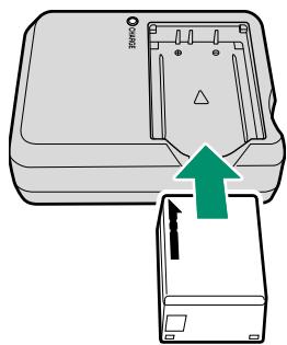 FUJIFILM GFX 100 - Place the battery in the charger. - 1