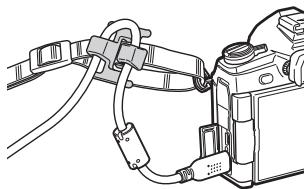 OLYMPUS E-M1 MARK II - Fixation du clip de câble - 1
