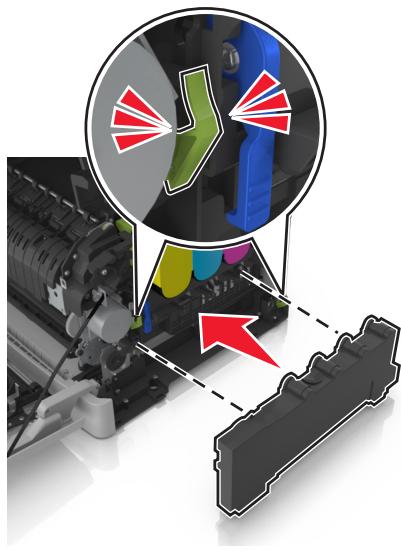LEXMARK CX517DE - Appuyez sur les leviers de couleur verte situés de chaque côté de la bouteille de récepération de toner, puis retirez cette dernière. - 2