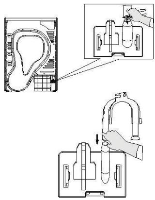 Technical diagram showing a device with a labeled component and its internal structure, including a hand holding a valve.