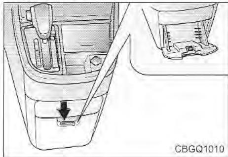 KIA Sedona KV2 (2002-2005) - COMPARTIMENT DE RANGEMENT DANS LA CONSOLE - 1