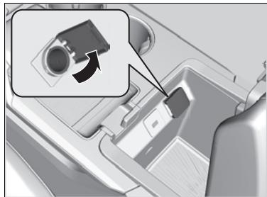 Acura MDX (2023) - ■ Prise électrique d'accessoire (compartiment inférieur du passager) - 1