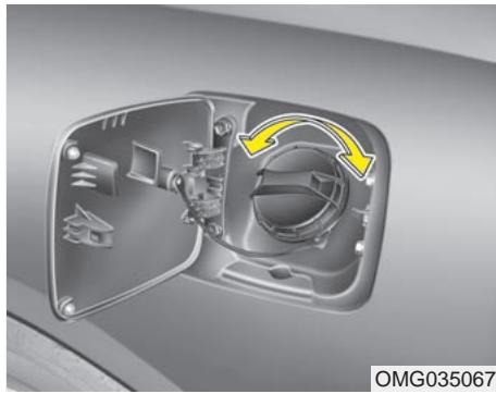 KIA Magentis MG (2005-2010) - Ouverture du volet du réservoir de carburant - 1