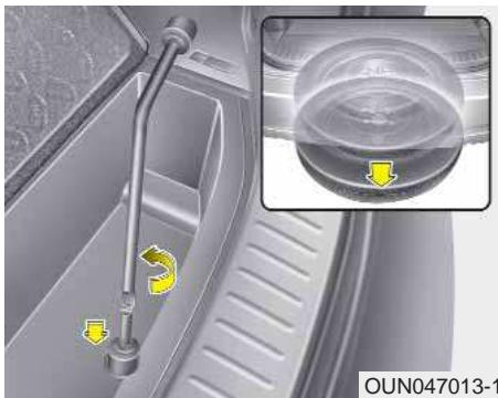 KIA Carens UN (2006-2010) - Retrait et rangement de la roue de secours - 1