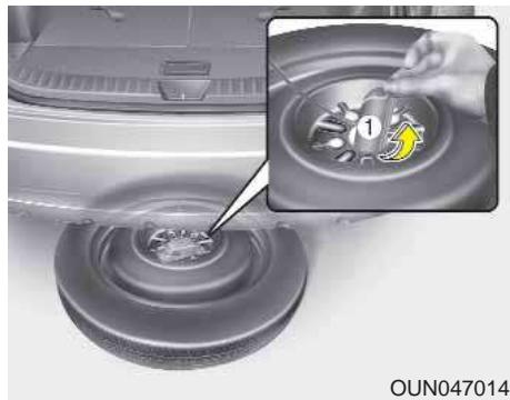 KIA Carens UN (2006-2010) - Retrait et rangement de la roue de secours - 2