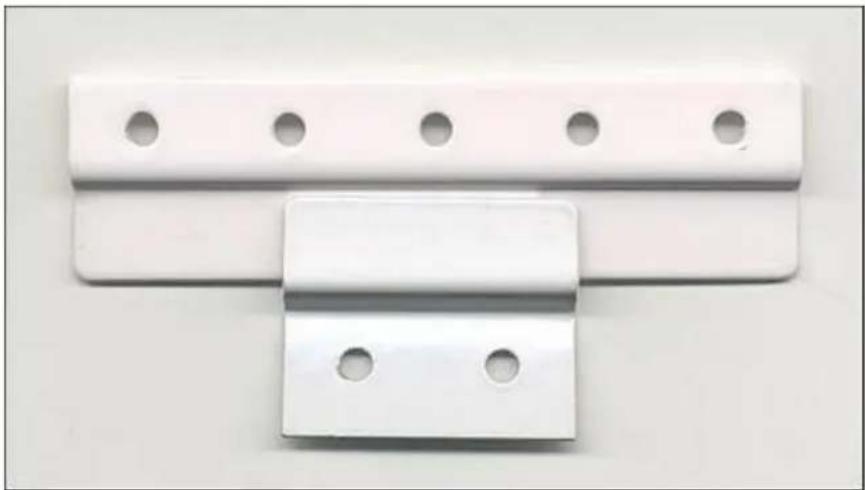 PKM KS 130.0 - White plastic electrical outlet bracket with two circular holes (no text or symbols visible)
The fridge can subsequently be restarted, see Page 6. - 2