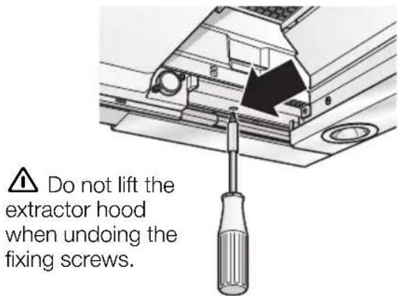 Do not lift the extractor hood when undoing the fixing screws.