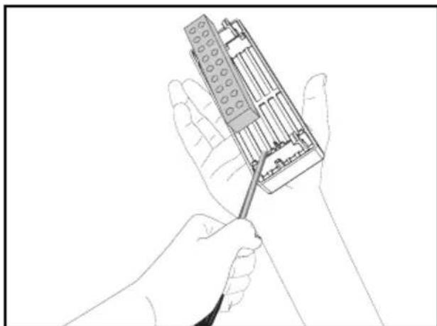 Line drawing of two hands holding a mechanical device with a tool (no text or symbols visible)