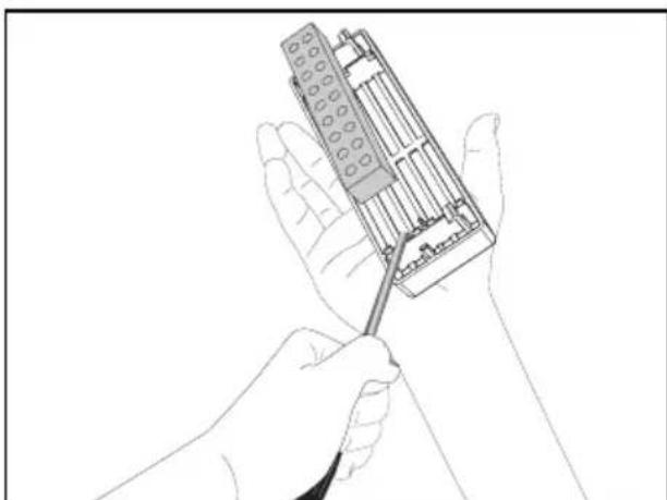 Line drawing of a hand holding a handheld electronic device with a cable (no text or symbols visible)