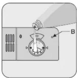 Diagram showing a device with a dial indicator and labeled component B, likely illustrating a mechanical or electrical setup.