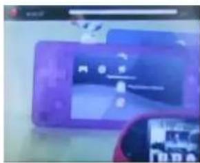 Scanned image of a purple mobile phone with visible app icons and text overlays