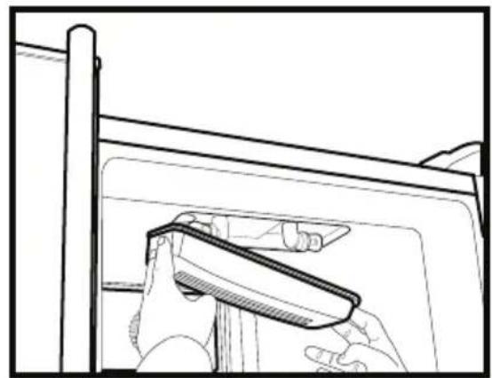 Line drawing of a hand holding a tool near a window frame (no text or symbols)